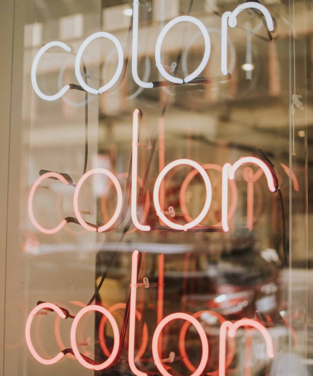 A neon sign with the word color in it.